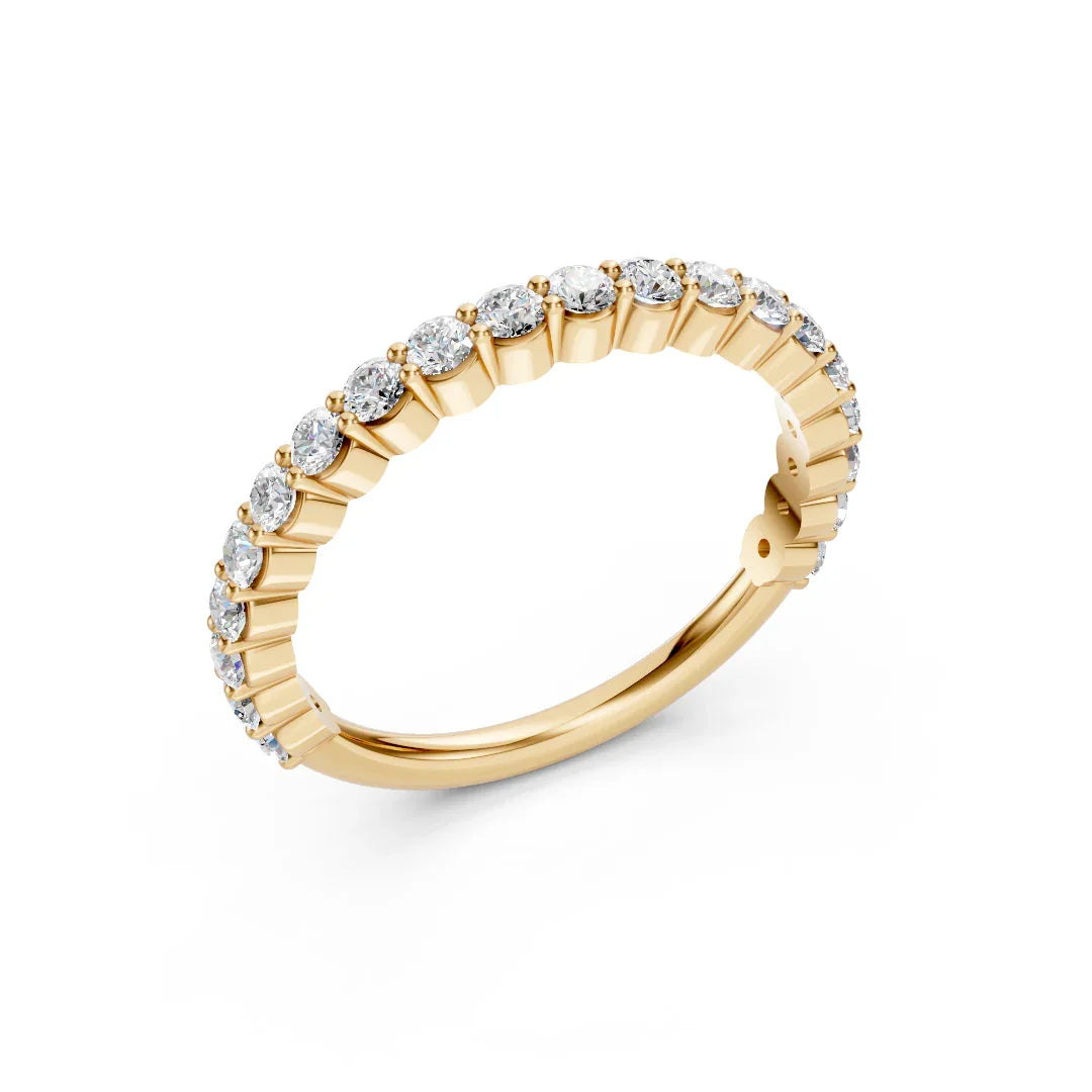Yellow gold eternity band with round diamonds in prong setting, custom jewelry design