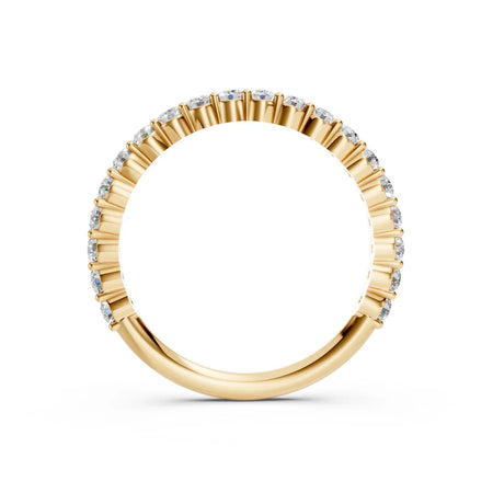Yellow gold eternity band with round diamonds in prong setting, custom jewelry design