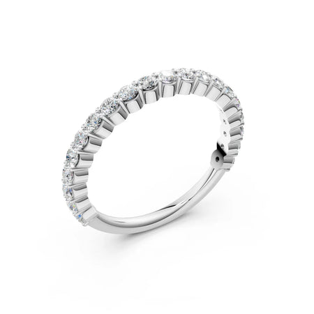 White gold diamond eternity band with round brilliant stones on a white background