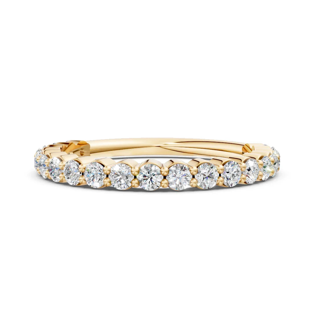 Yellow gold eternity band with round brilliant diamonds in a prong setting, custom jewelry