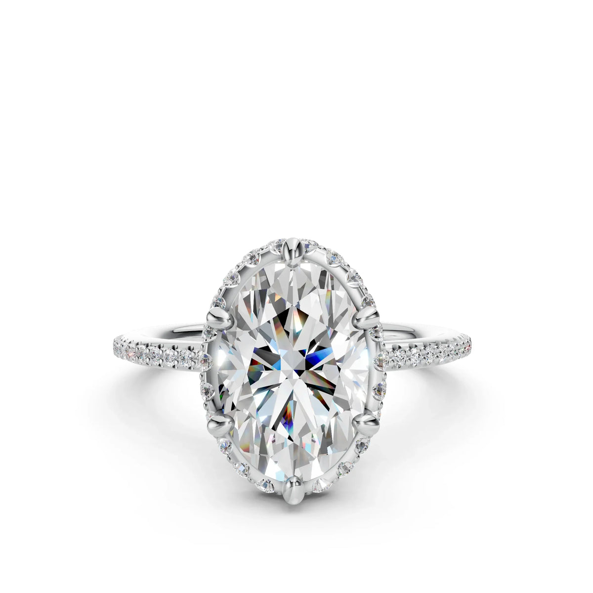 Oval cut diamond engagement ring with pavé band on white background