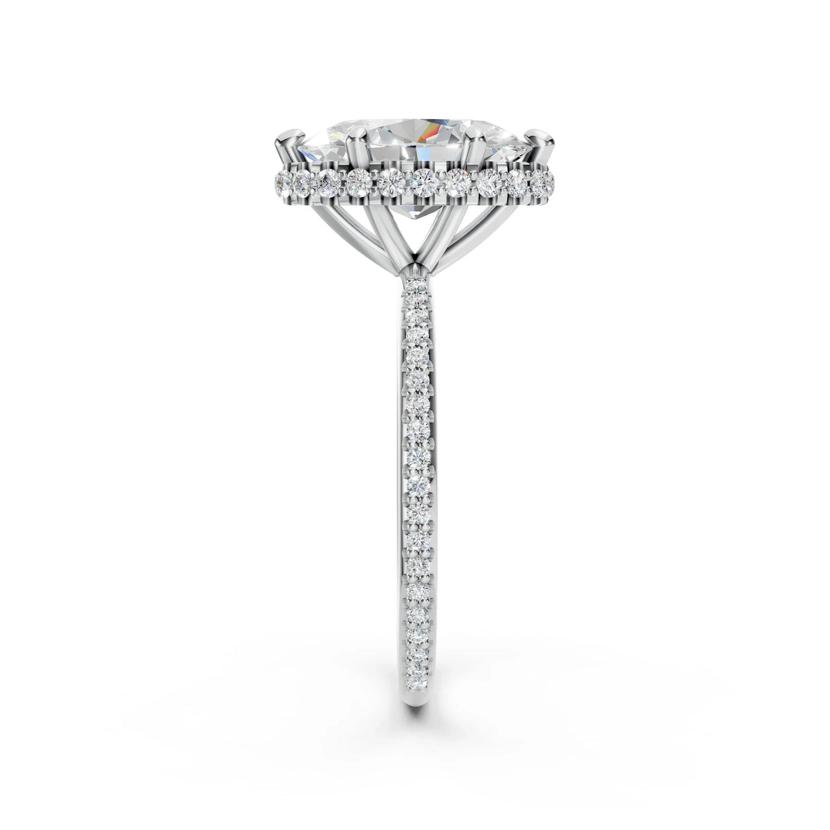 Side view of a diamond engagement ring with pavé band and halo setting