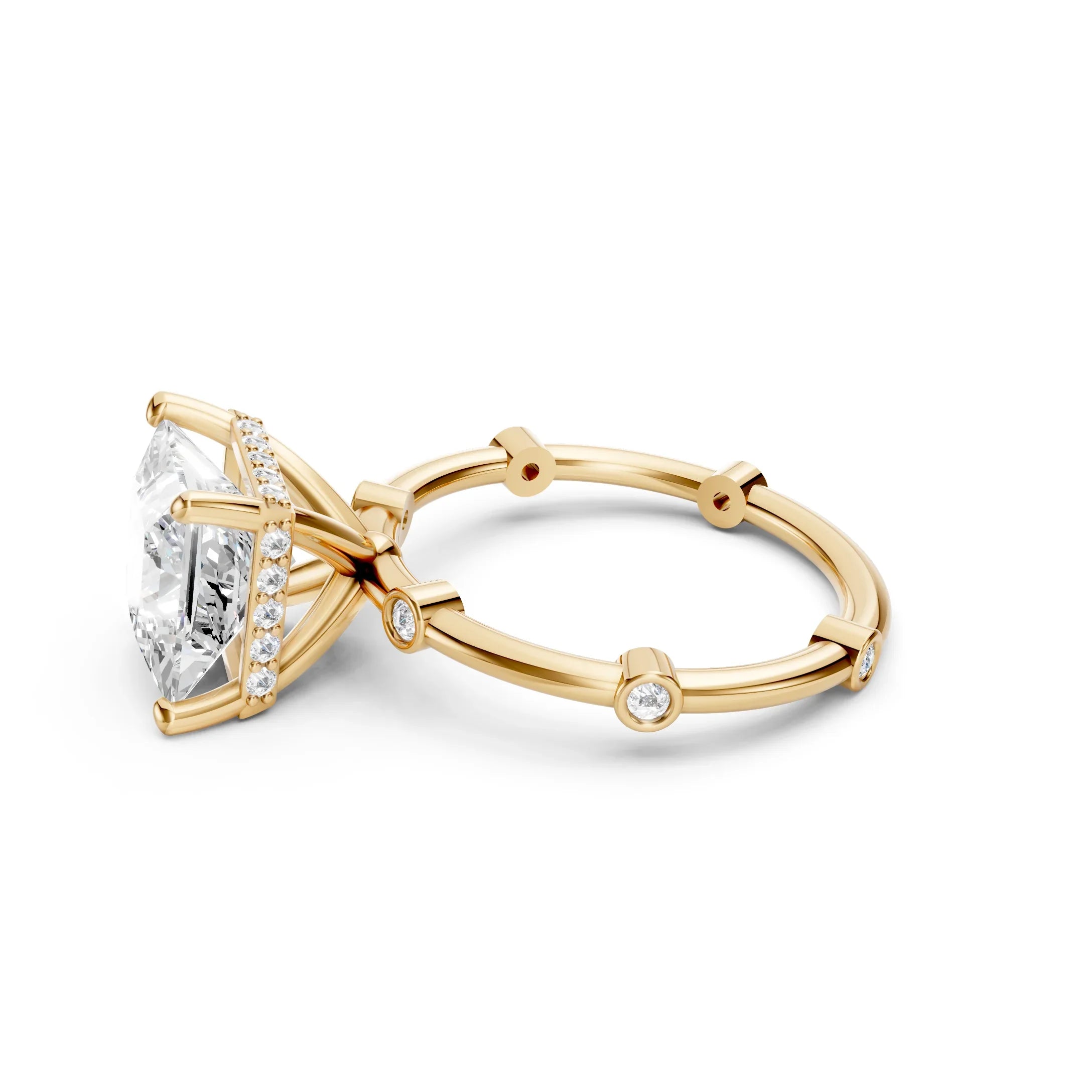 Yellow gold engagement ring with large rectangular diamond and accent side stones