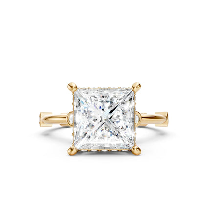 Princess cut diamond solitaire engagement ring in yellow gold setting
