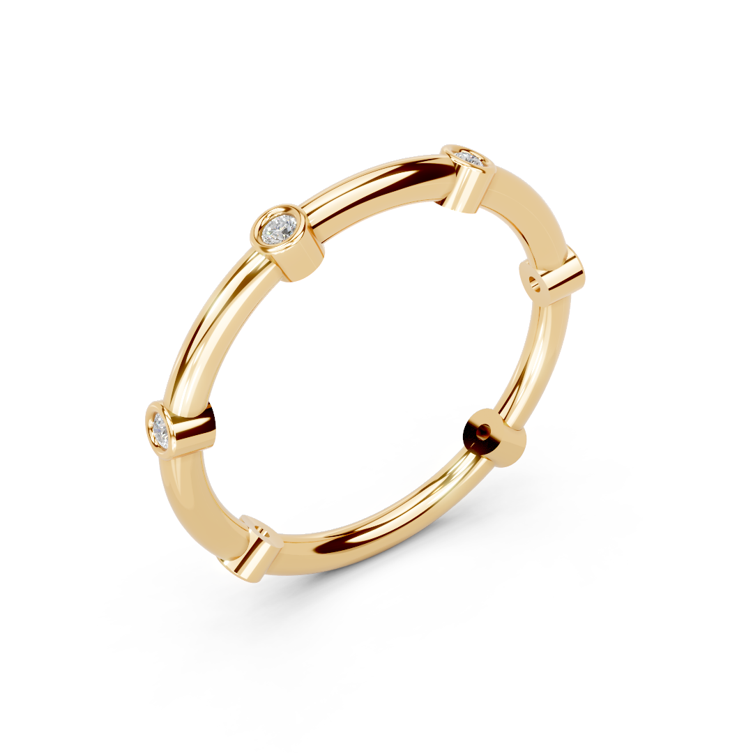 Yellow gold stacking ring with bezel-set round diamonds, minimalist band jewelry