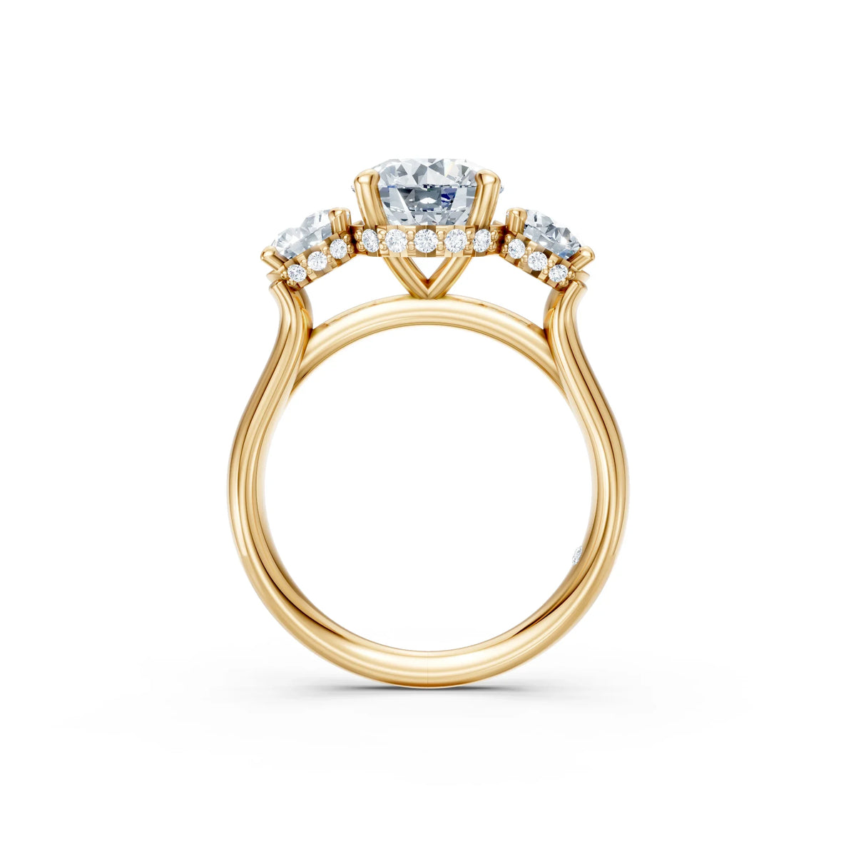 Three-stone yellow gold engagement ring with round diamonds and pavé band, side view