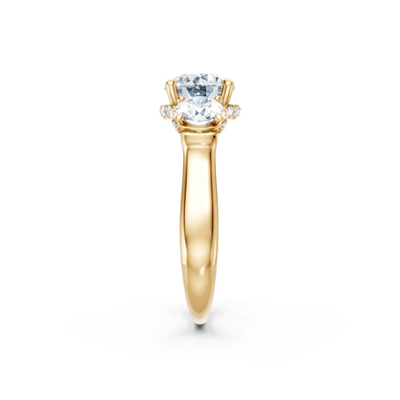 Yellow gold engagement ring with two oval diamonds and smaller side stones
