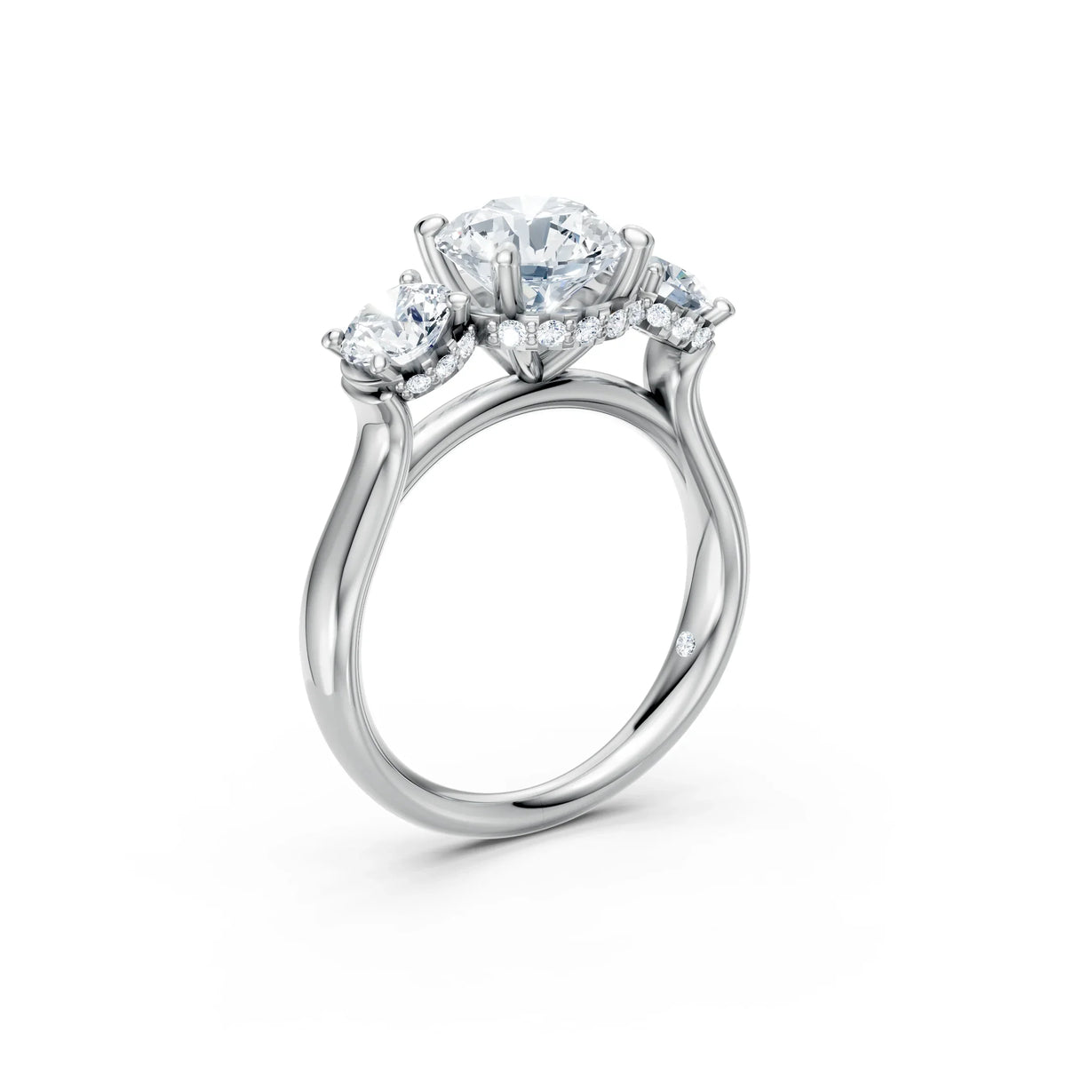 Three stone diamond engagement ring in white gold with round brilliant diamonds