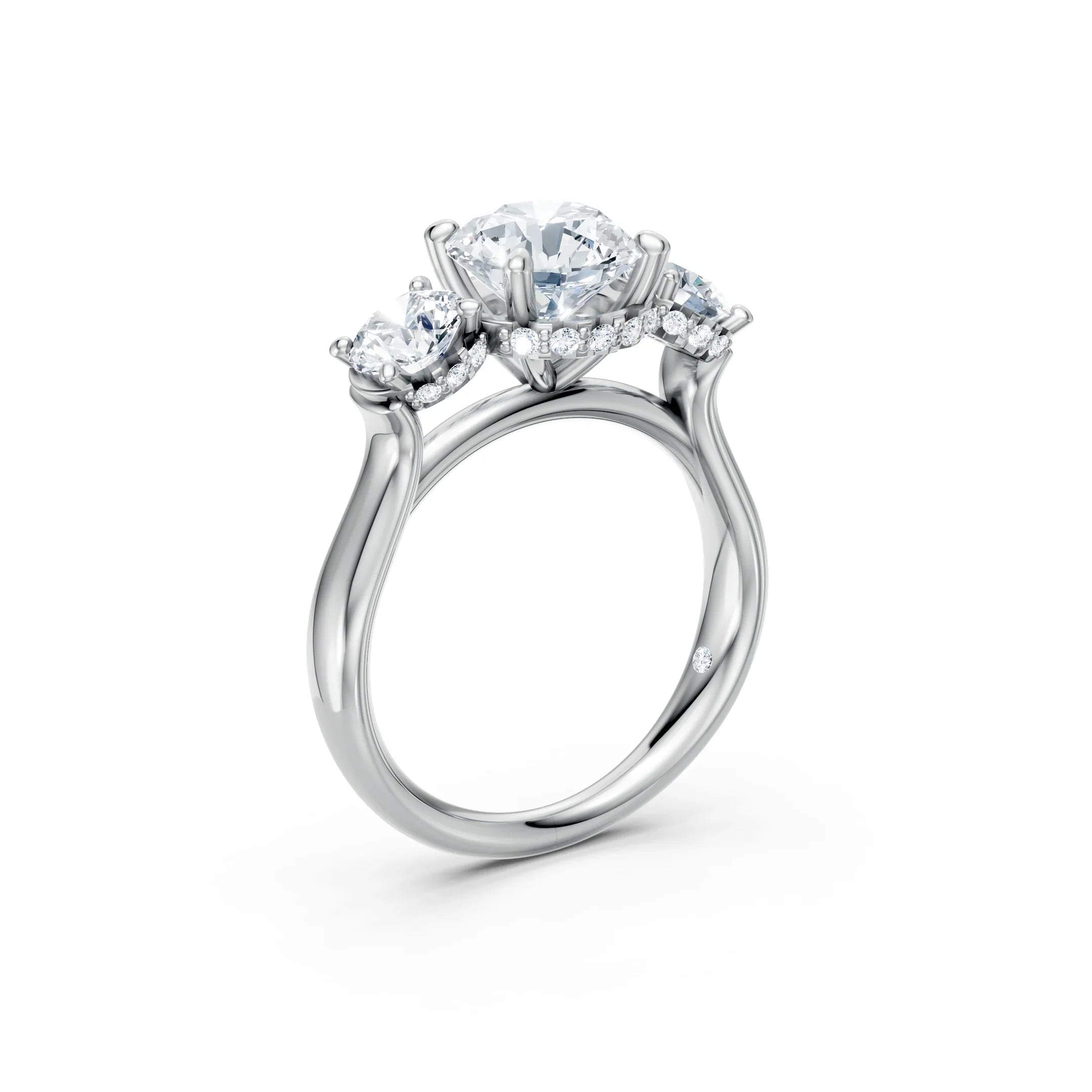 Three stone diamond engagement ring in white gold with round brilliant diamonds