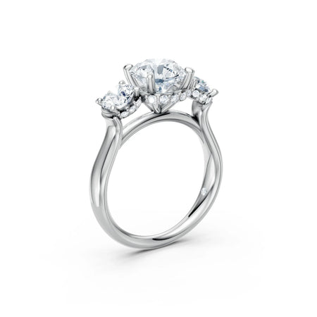Three stone diamond engagement ring in white gold with round brilliant diamonds