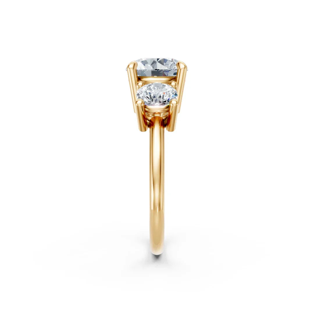 Two-stone gold engagement ring with round and oval diamonds in prong setting