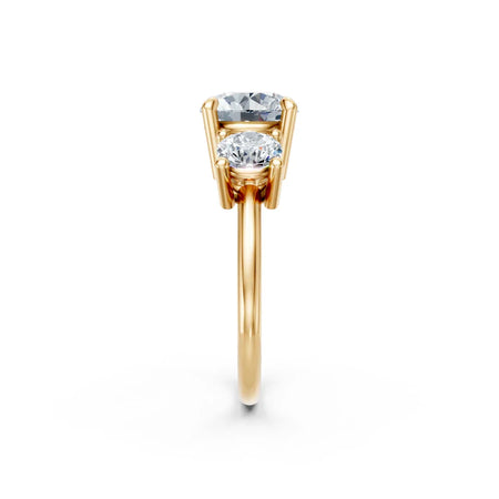 Two-stone gold engagement ring with round and oval diamonds in prong setting
