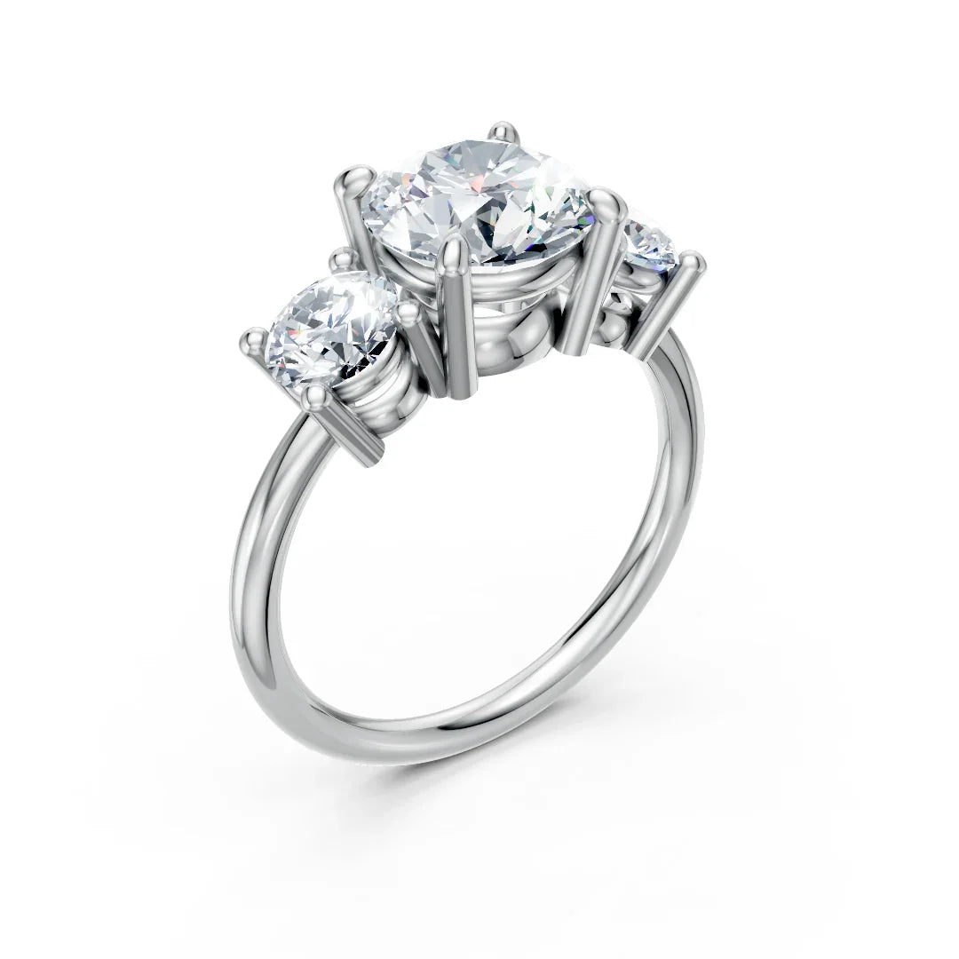 Three-stone white gold engagement ring with round brilliant cut diamonds