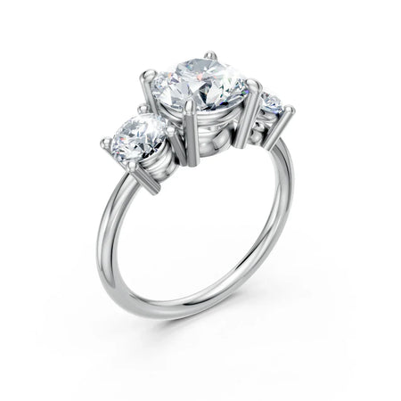 Three-stone white gold engagement ring with round brilliant cut diamonds