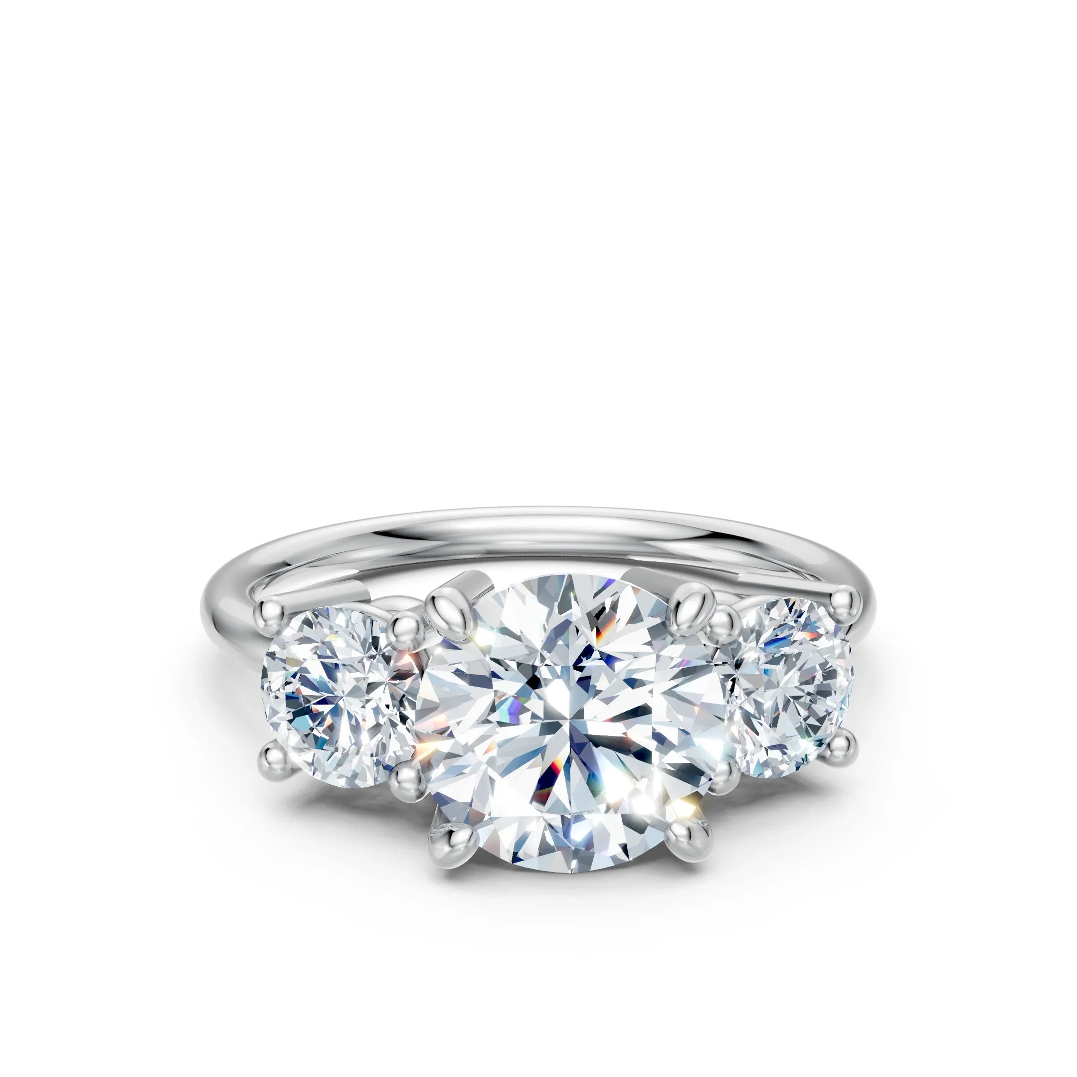 Three-stone diamond engagement ring with round brilliant cut stones on a white gold band