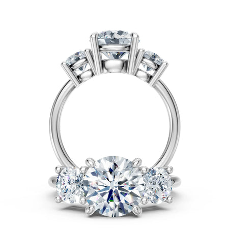 Three-stone diamond engagement ring with round cut diamonds on a white gold band