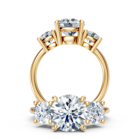 Three stone gold engagement ring with round cut diamonds, custom jewelry design