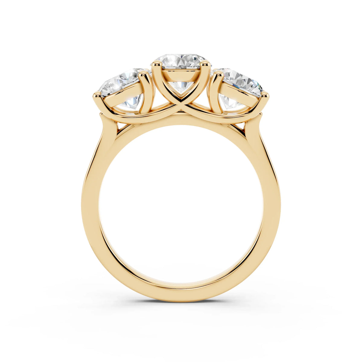 Three-stone yellow gold ring with round diamonds in a custom engagement ring setting