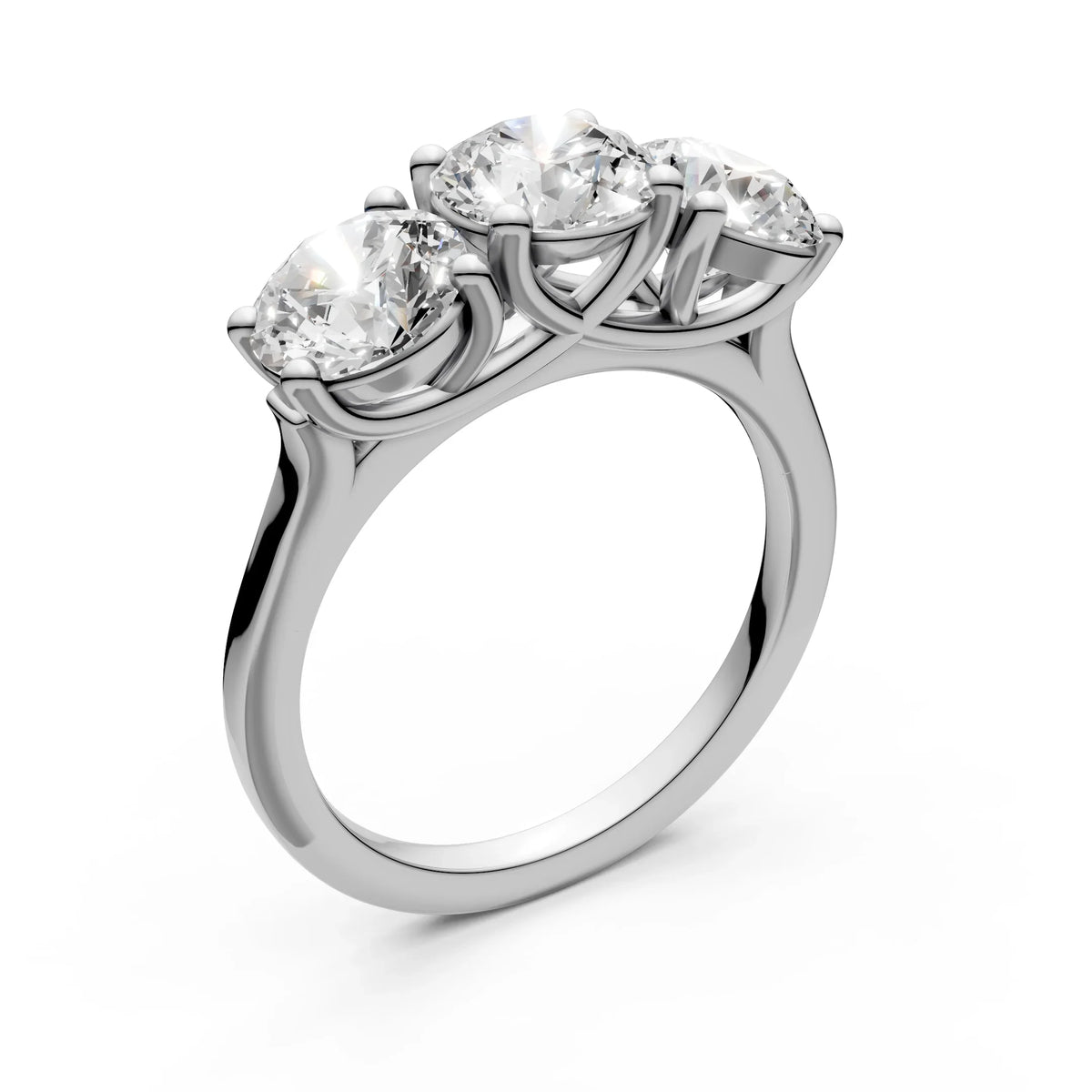 Three-stone diamond engagement ring with round brilliant cut stones on a white gold band