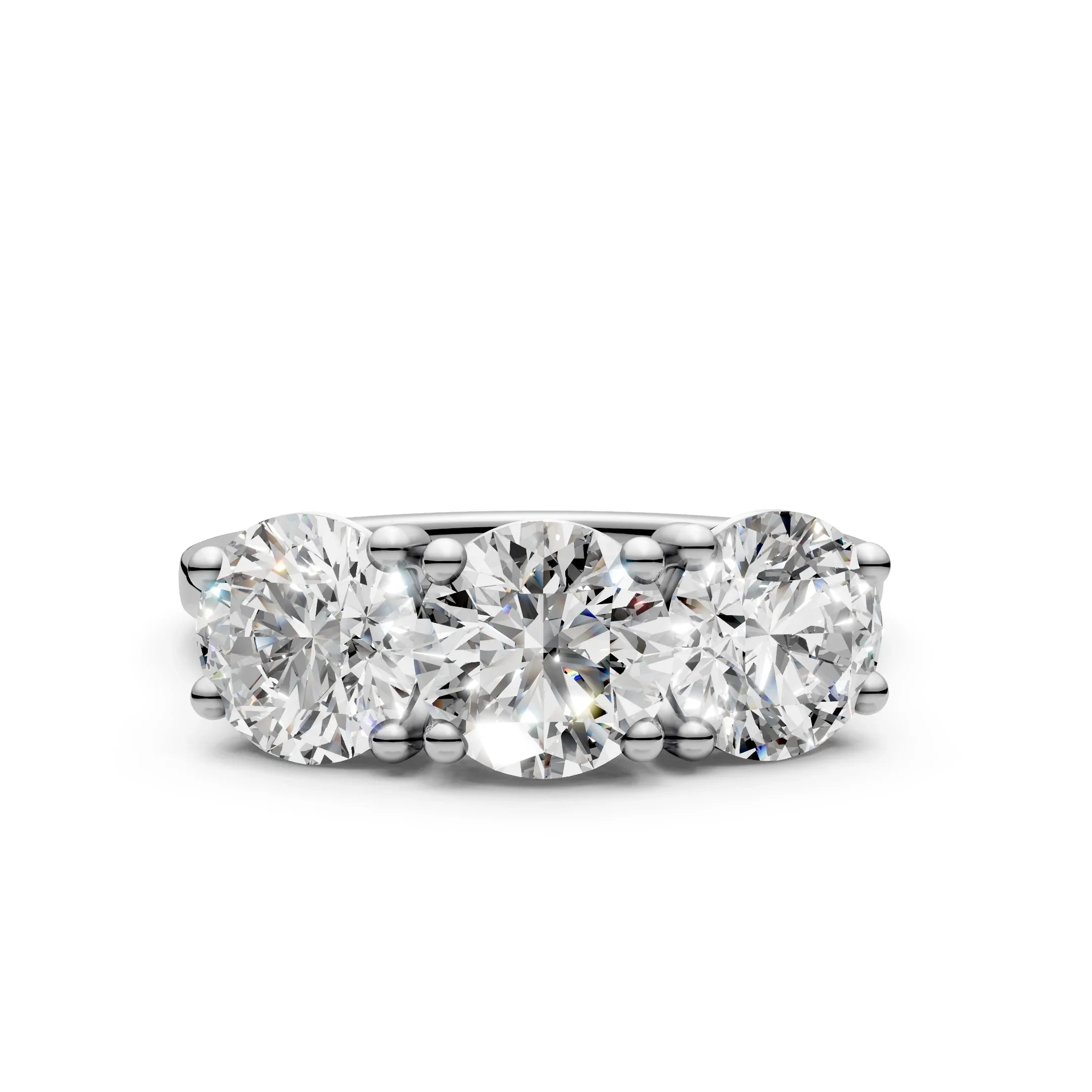 Three stone diamond engagement ring in white gold setting, round brilliant cut diamonds