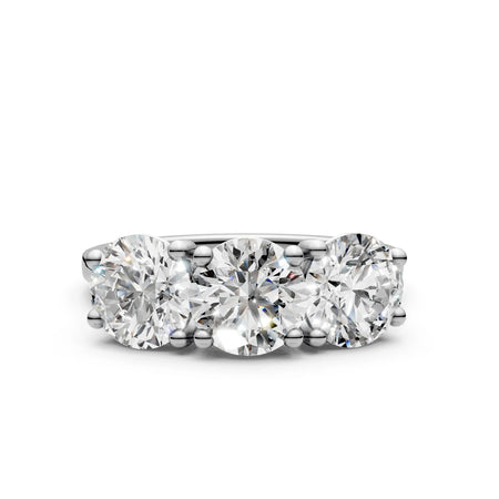Three stone diamond engagement ring in white gold setting, round brilliant cut diamonds