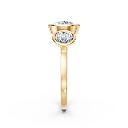 Yellow gold engagement ring with round diamond side view, modern bezel setting