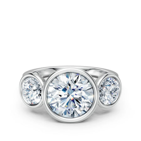 Three stone diamond engagement ring in white gold with round brilliant cut gems