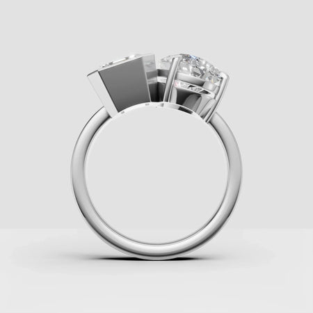 Side view of a custom white gold ring with two round diamonds in modern settings