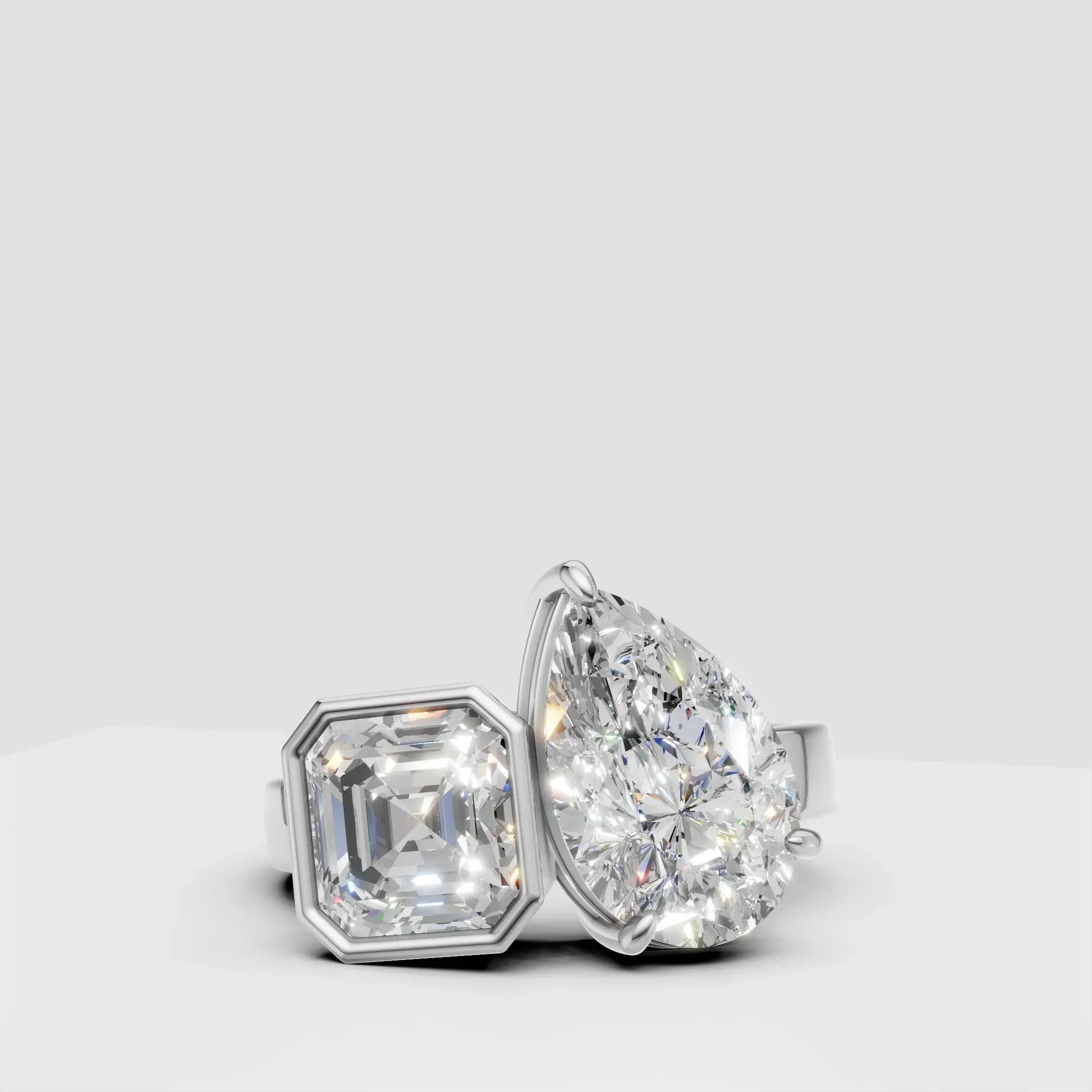 White gold ring with asscher and pear shaped diamonds, modern custom design jewelry
