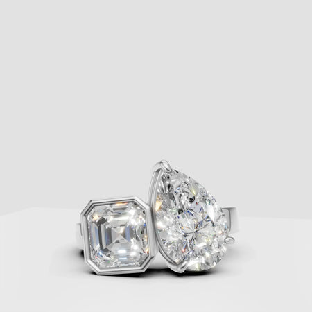 White gold ring with asscher and pear shaped diamonds, modern custom design jewelry