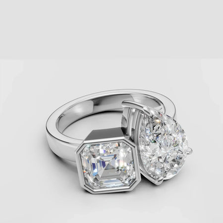 Custom two-stone engagement ring with pear and Asscher cut diamonds in white gold setting