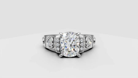 Custom white gold engagement ring with oval center diamond and side accent stones
