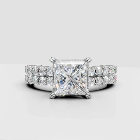 Princess cut diamond engagement ring with double row pavé band set in white gold