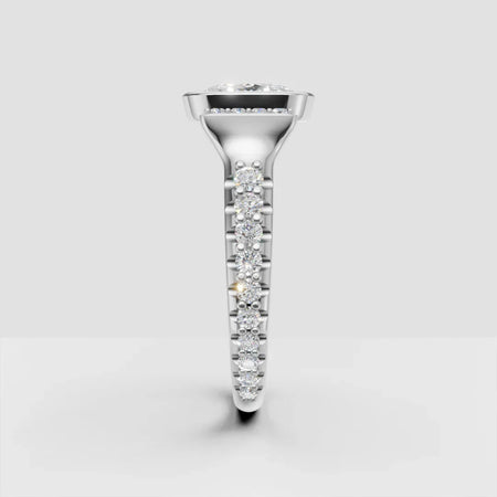 Side view of a custom white gold engagement ring with a round center diamond and diamond band