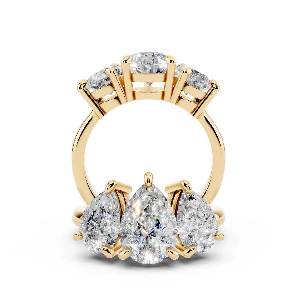 Yellow gold band with three pear-shaped diamonds in custom engagement ring setting