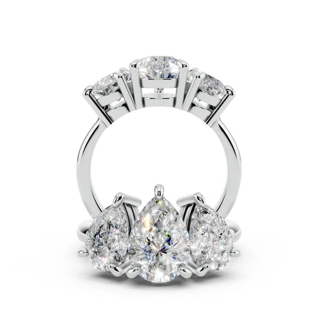 Platinum ring with pear-shaped and round diamonds in a custom engagement ring setting