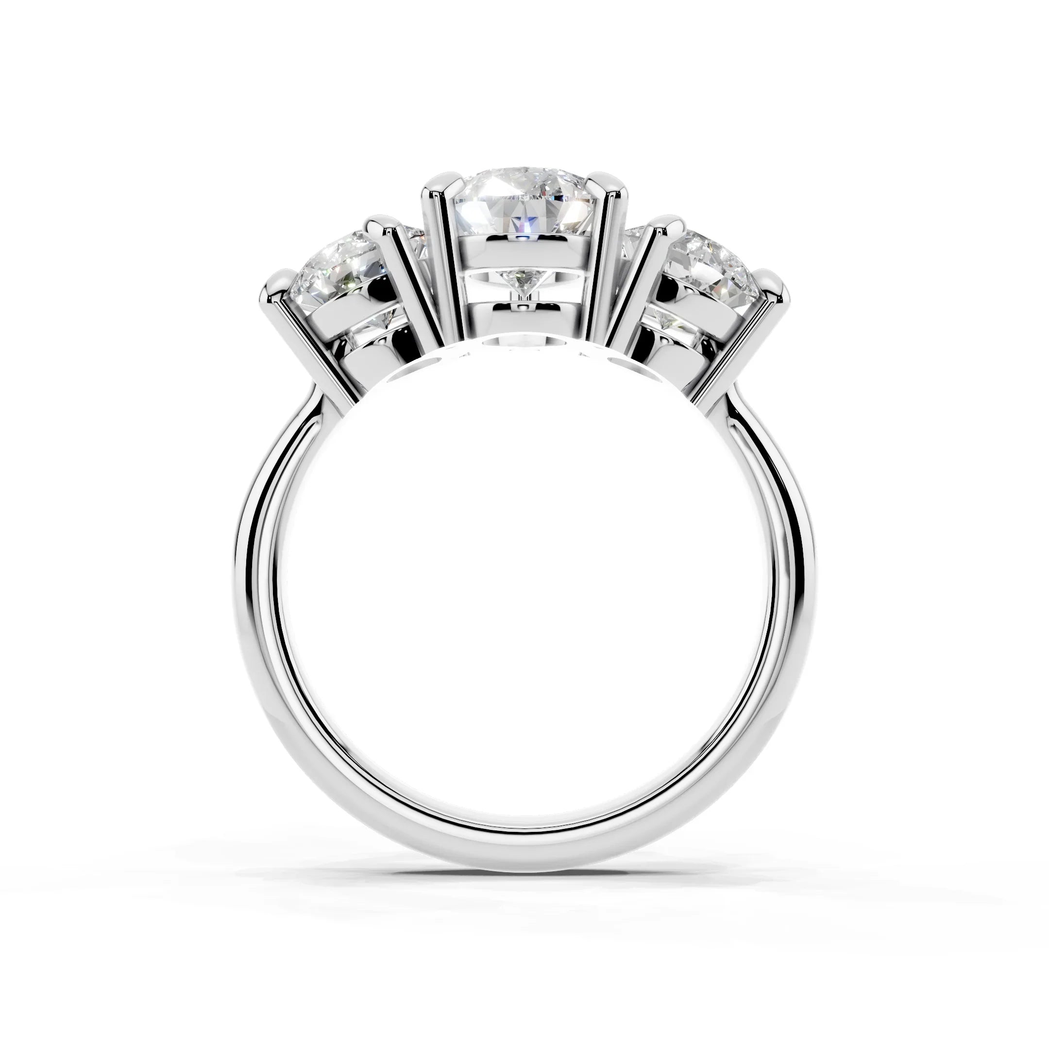 Three-stone white gold engagement ring with round cut diamonds in prong settings