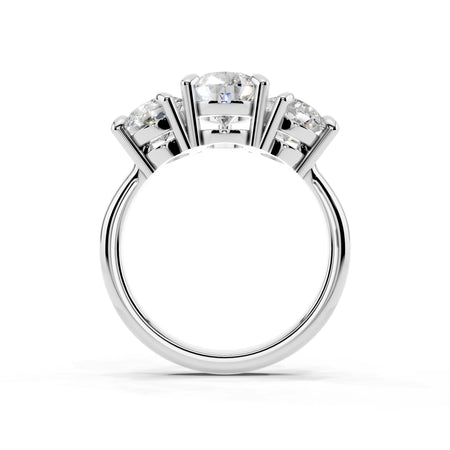 Three-stone white gold engagement ring with round cut diamonds in prong settings