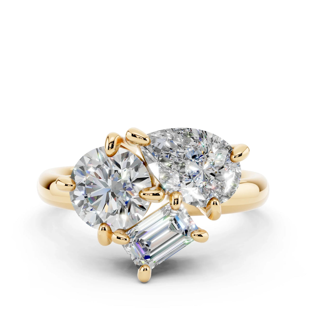 Yellow gold ring with round, pear, and emerald-cut diamonds in a unique setting
