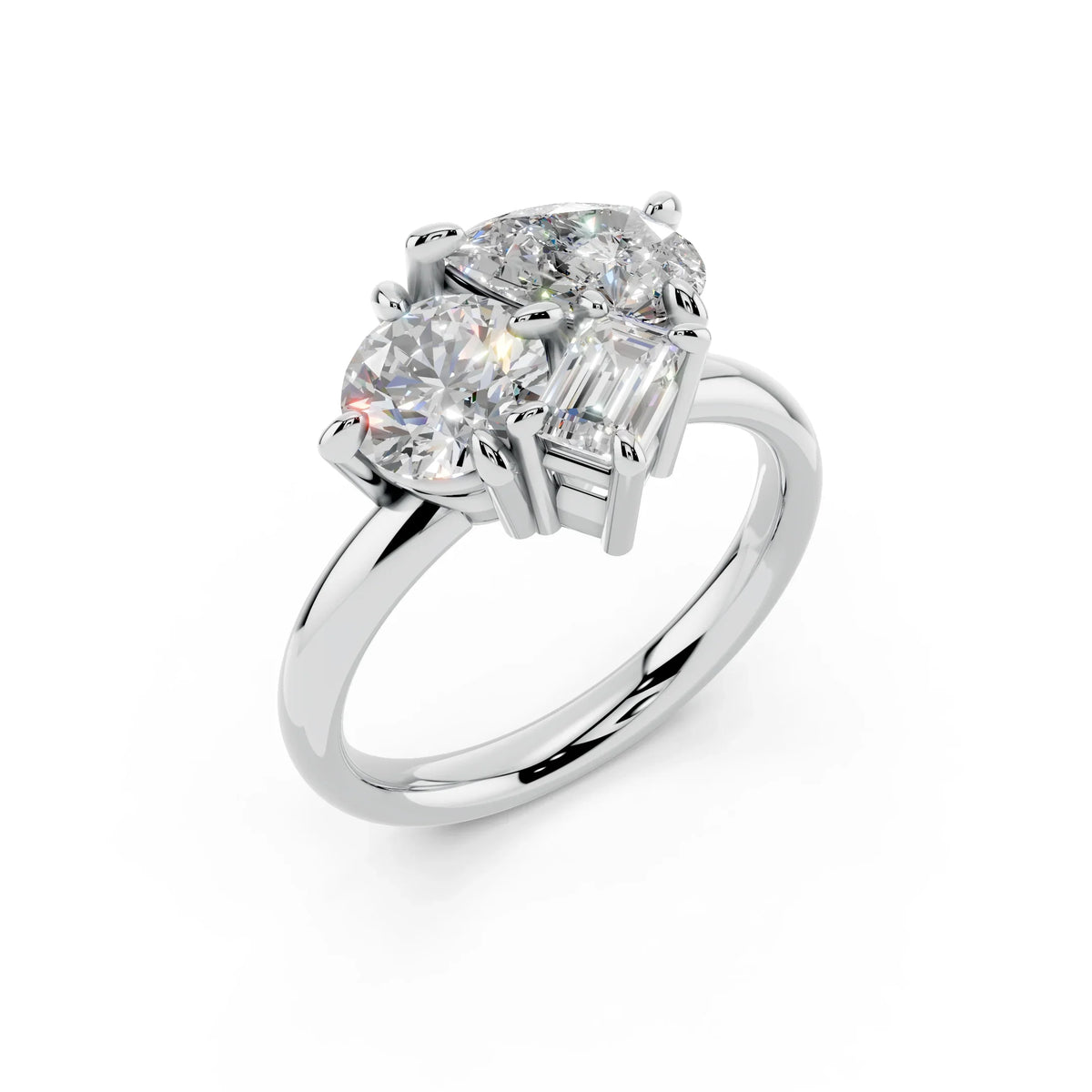 Three stone custom diamond engagement ring with round and emerald cut gems on white gold band