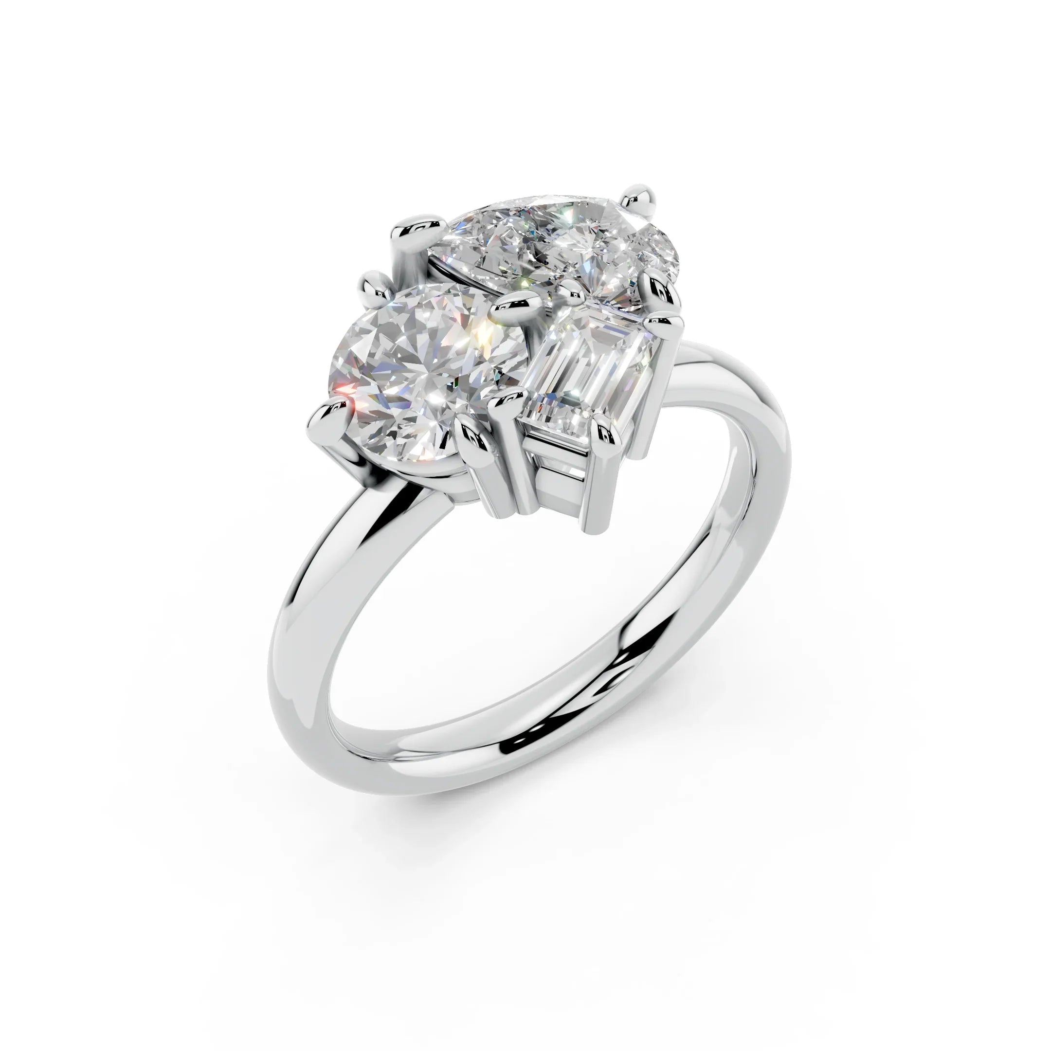 Three stone custom diamond engagement ring with round and emerald cut gems on white gold band