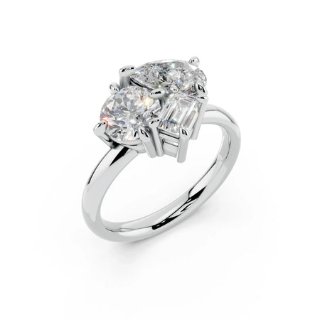 Three stone custom diamond engagement ring with round and emerald cut gems on white gold band