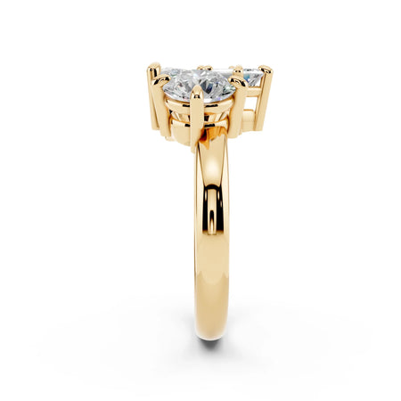 Side view of yellow gold engagement ring with three clear gemstones