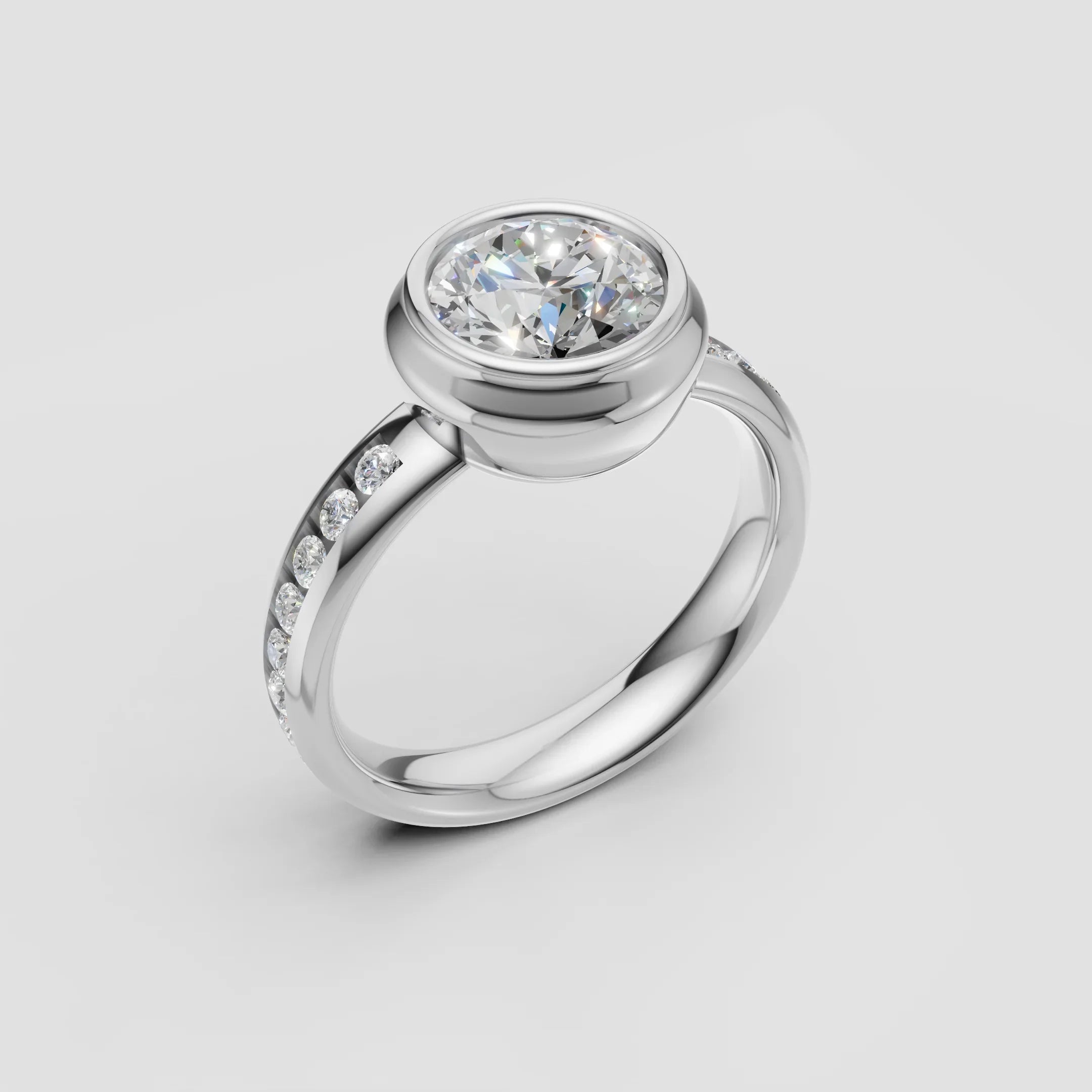 White gold engagement ring with bezel-set round diamond and diamond-accented band