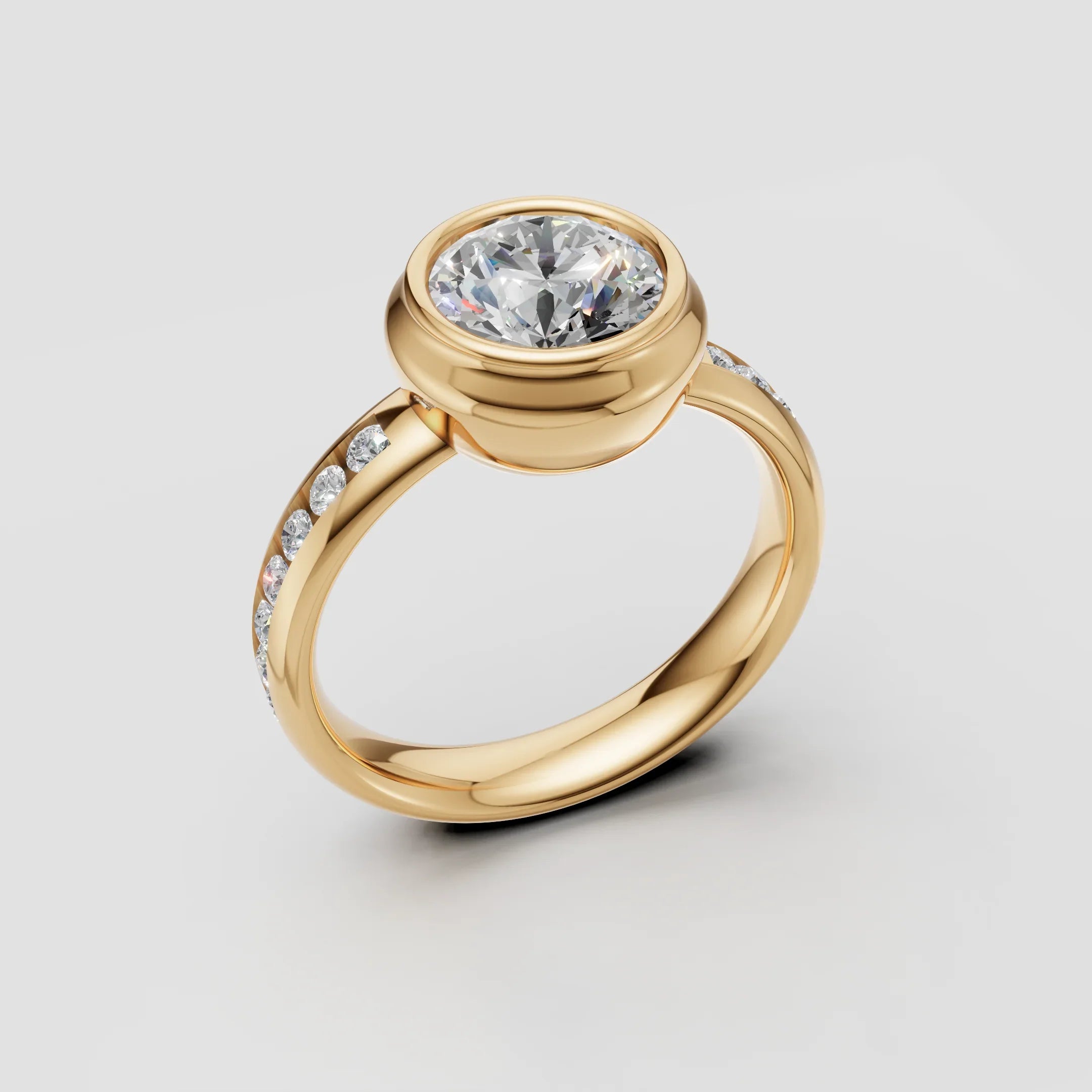 Yellow gold engagement ring with bezel-set round diamond and pavé band