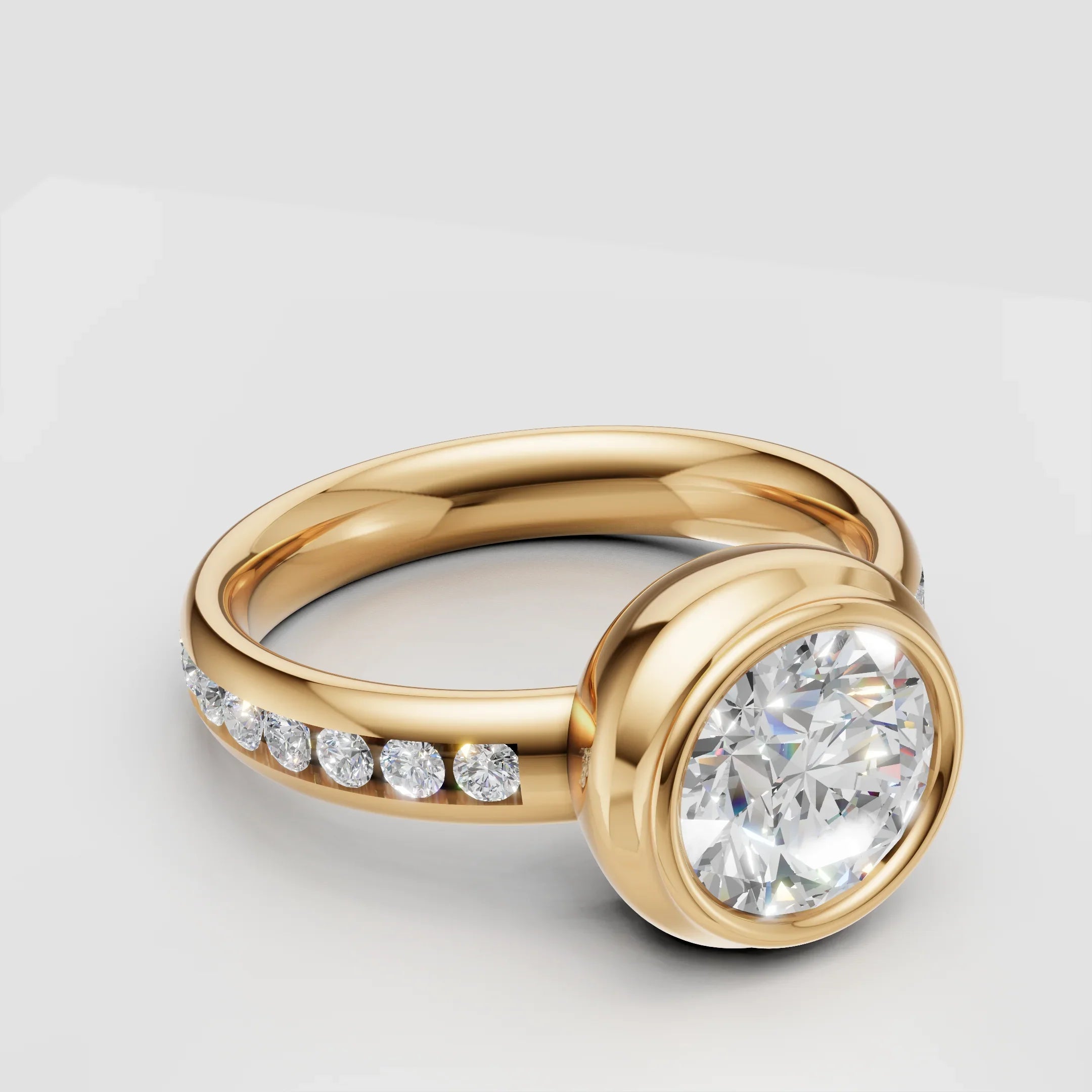 Gold engagement ring with round bezel-set center diamond and side accent diamonds