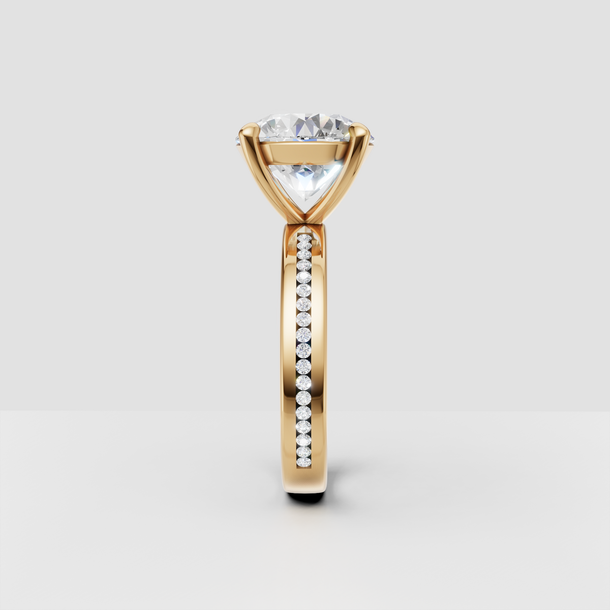 Yellow gold engagement ring with round diamond and pavé band, side profile view