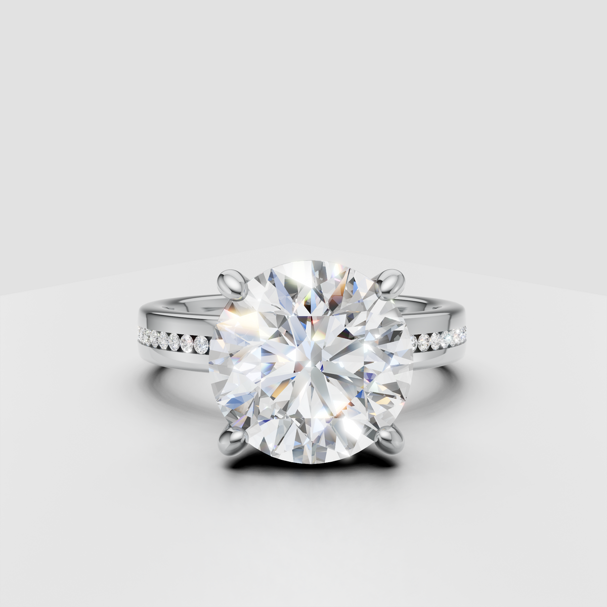 Round cut diamond engagement ring with pavé band in white gold setting