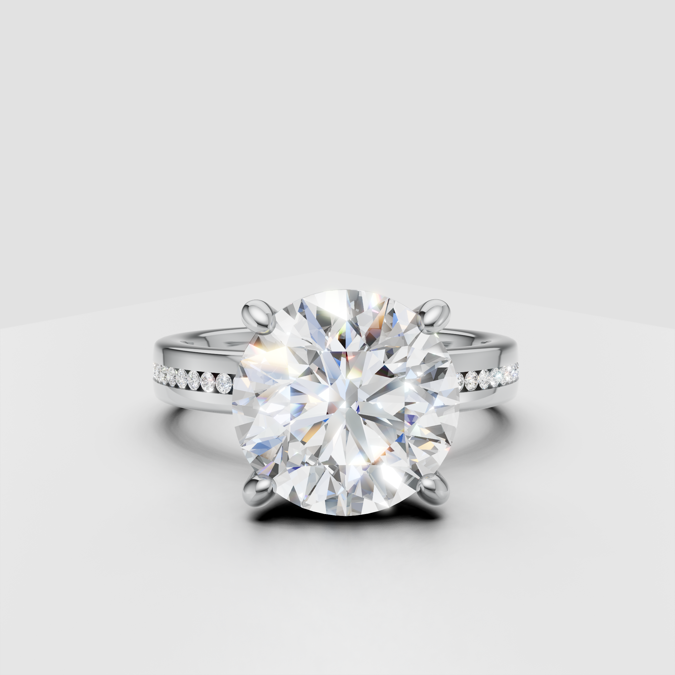 Round cut diamond engagement ring with pavé band in white gold setting
