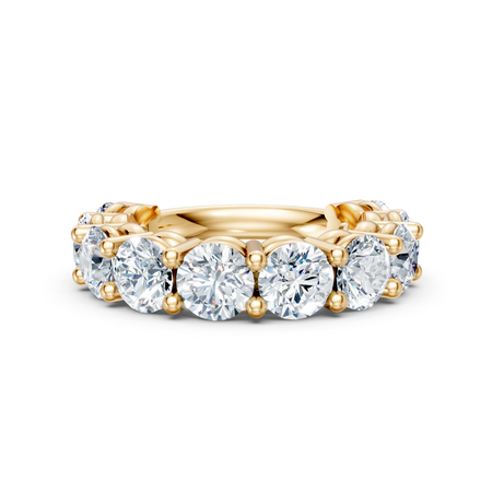Yellow gold eternity ring with large round-cut diamonds, custom fine jewelry